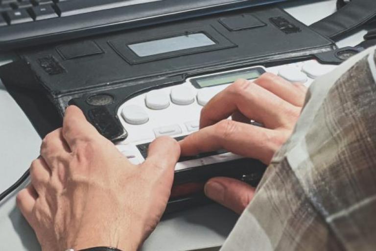 Image with someone typing on a keyboard